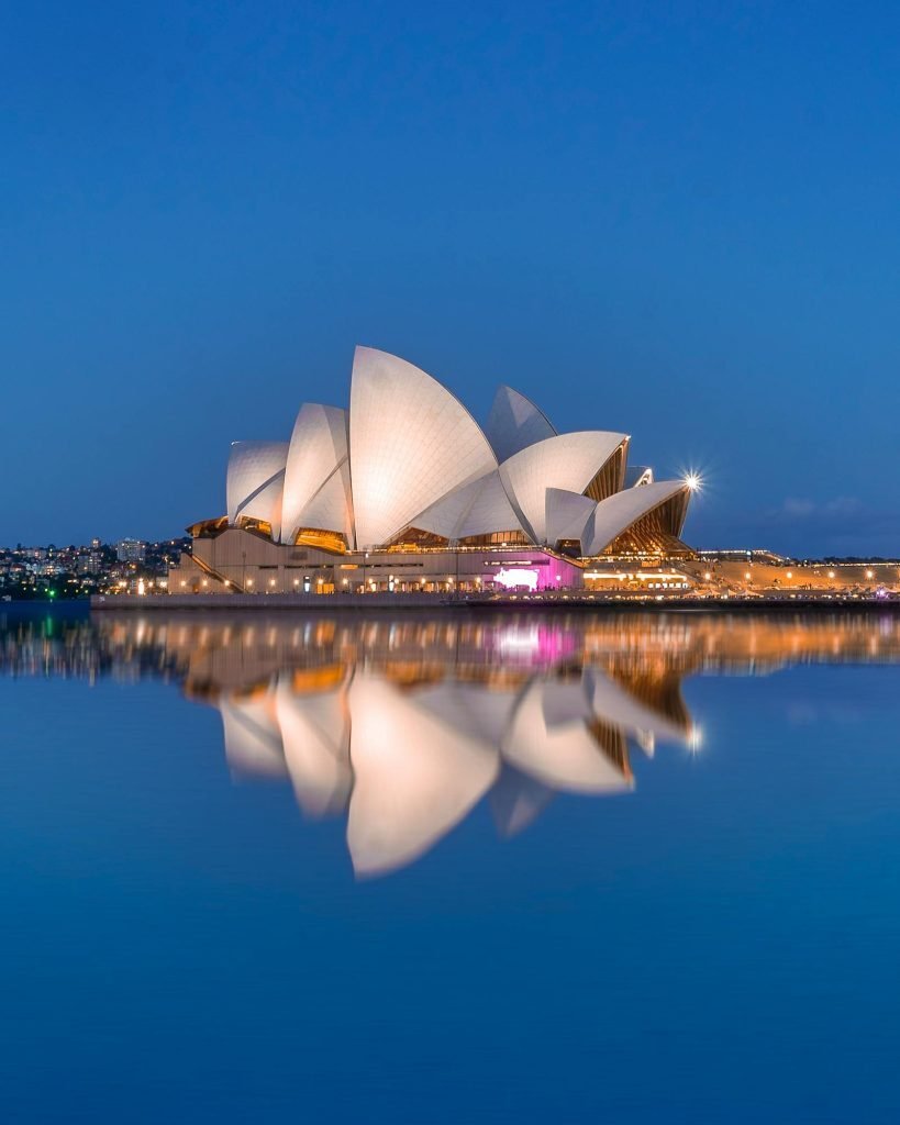 Sydney Opera House and harbour at sunset