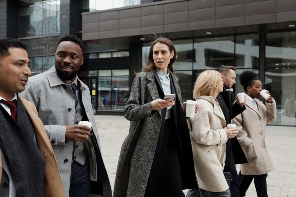 Trade compliance team walking together outside an office building