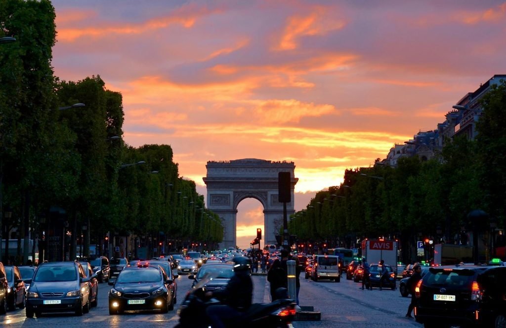 Paris — the Arc de Triomphe at sunset, seen down the Champs-Élysées