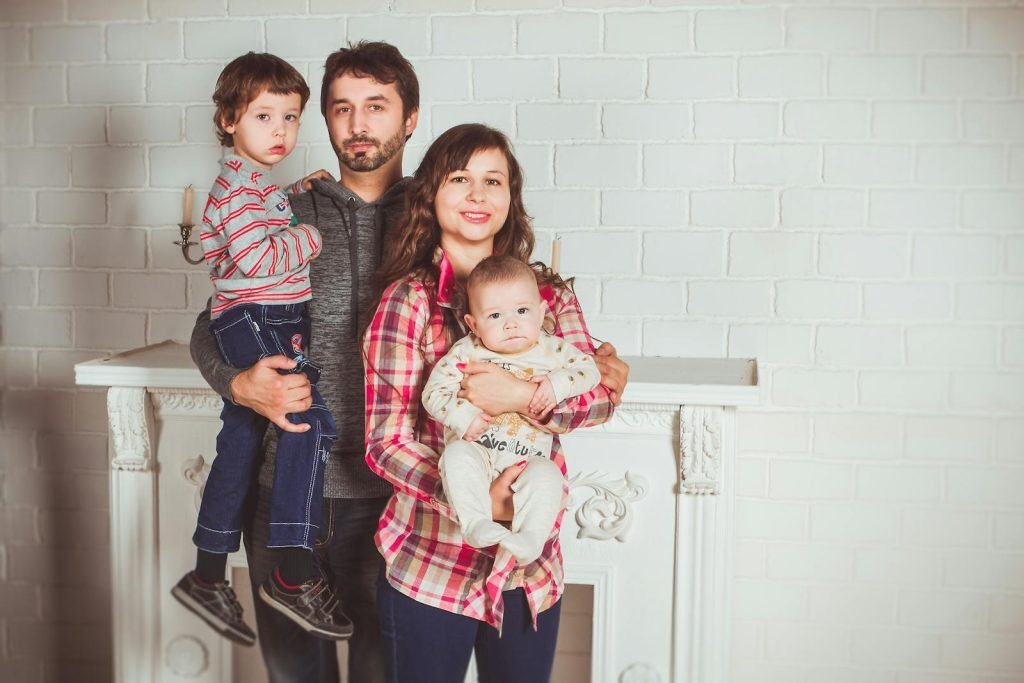 Indian family at airport preparing to relocate abroad with children