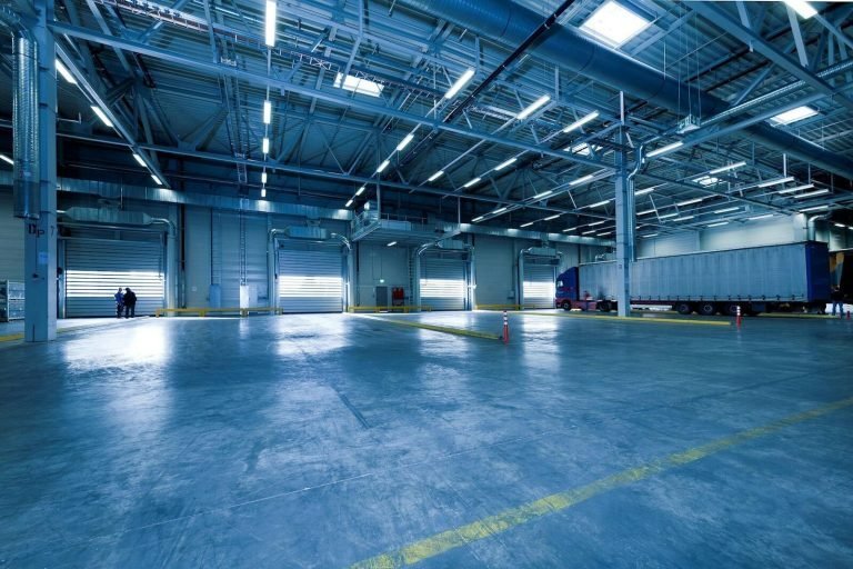 Large industrial distribution hall with a trailer at the loading bay