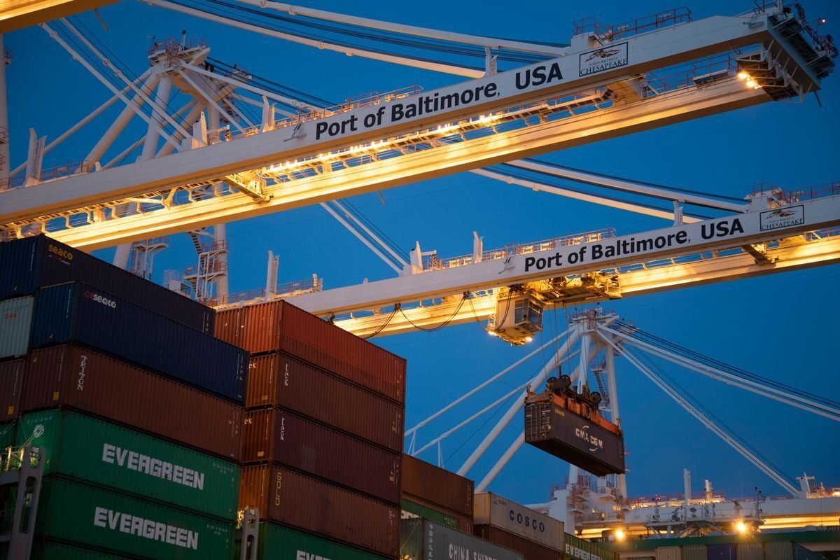 Ship-to-shore gantry cranes lifting a container at a deep-water port