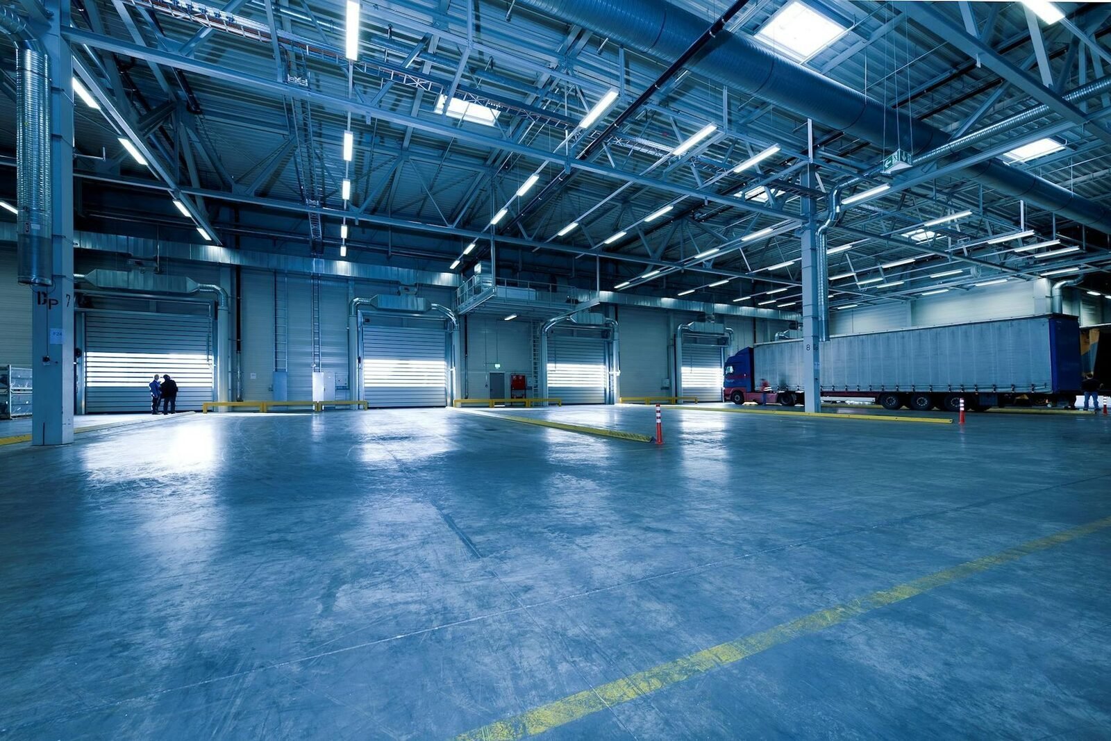 Large industrial distribution hall with a trailer at the loading bay