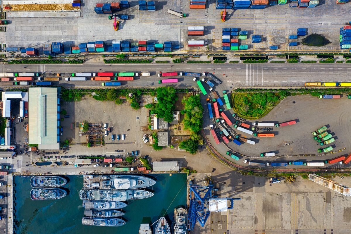 Aerial view of a working port with quays and vessels