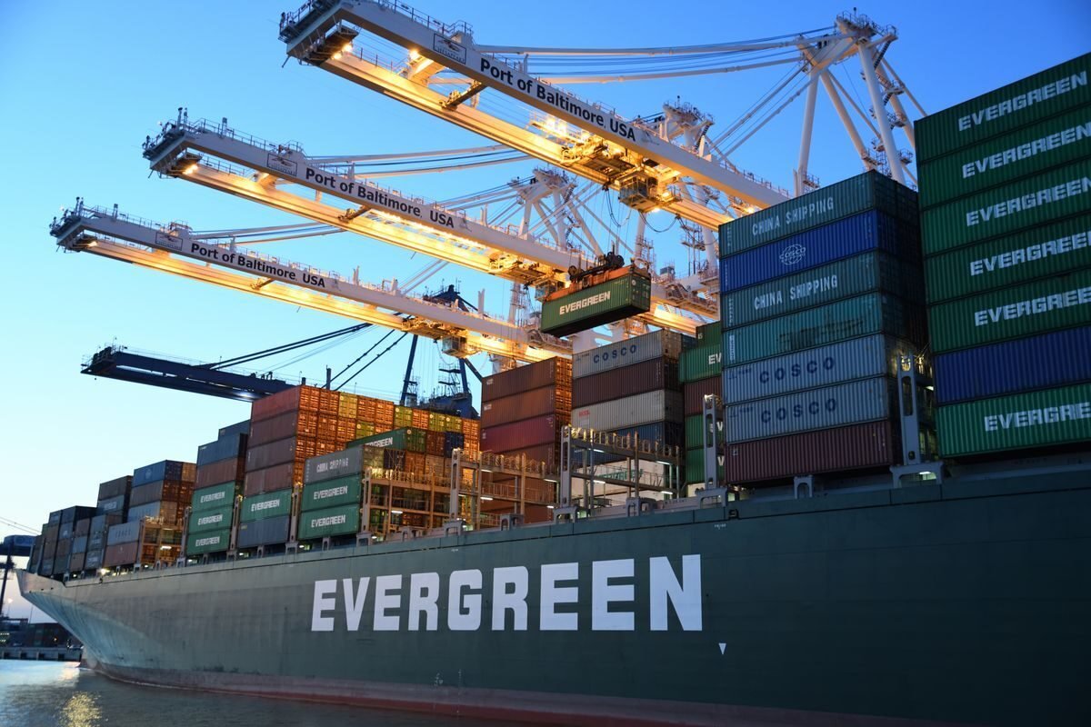 Container ship berthed under gantry cranes at a deep-water port